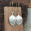Thumbnail: silver lunaria seed pod drop earrings - rock rose jewellery