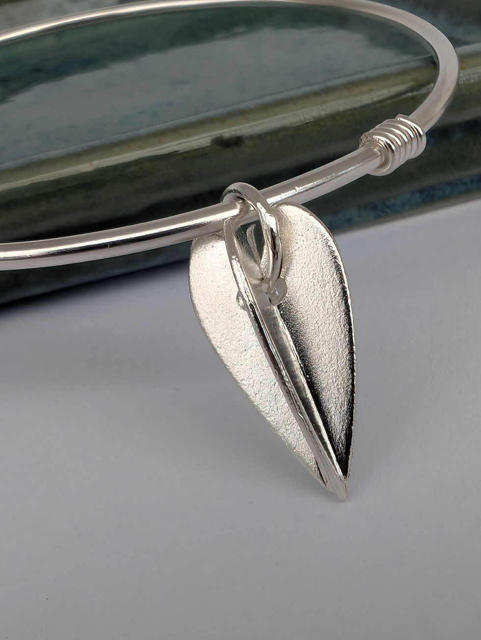 Thumbnail: ladies silver bangle with a geometric silver heart