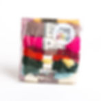 Front of Make and Mend needlepoint starter kit in a clear plastic bag with skeins of yarn, plastic canvas and needle