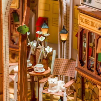 Close up of cafe and bookshelf in Sunshine Town Shelf Insert Kit