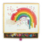 box with drawer pulled out of jonathan adler rainbow hands puzzle showing puzzle pieces with foil accents