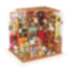 Completed Sams study DIY dollhouse miniature kit with a library full of books, red chair, ladder and bookshelves by robotime