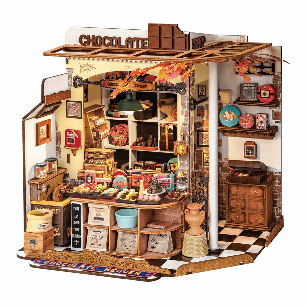Henry's chocolate shop diy kit featuring pastries, sweets, truffles, bonbons, boxed chocolate and more displayed in a candy shop