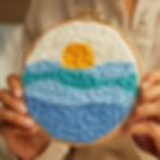 Image of completed ocean themed punch needle kit including the hoop