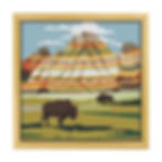 Completed cross stitch design of badlands national park in a square wooden frame for hanging