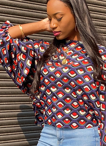 All Eyes On You Blouse. SIDE POSE.jpeg