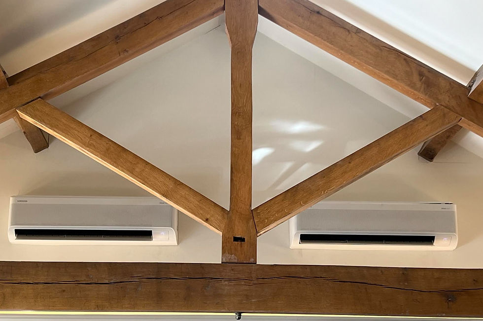 Stylish North West interior with exposed wooden truss ceiling and integrated air conditioning vents, combining architectural