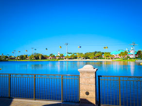 A photo of the sun beating down on the water of Crescent Lake in Walt Disney World.