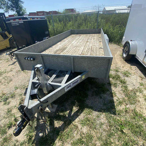 Heavy-duty 7x16 galvanized open trailer with tandem axles, working brakes, 8k jack, spare tire & custom gate.