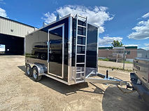 2026 7x14 galvanized V nose enclosed trailer with 5k axles, roof racks, Drymax floor, and ramp door – on order.