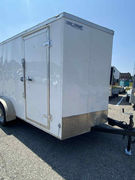 2023 7x14 enclosed trailer, ramp door, 6’6” height, steel frame, new tires, 2-5/16” ball — great condition!