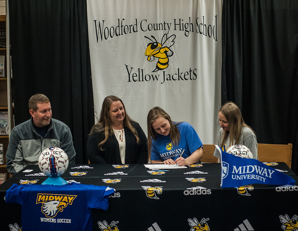 KRISTEN JORDAN signed her letter of intent to play soccer for Midway University on Monday, Jan.22. Pictured from left: stepfather, Scott Lockridge , mother, Kim Jordan, Kristen and her sister, Ashley Jordan . (Photo by Bill Caine)