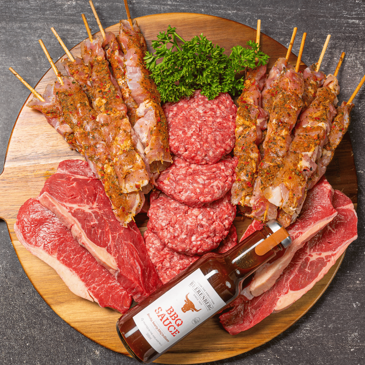 BBQ box with porterhouse steaks, beef burger patties, Mediterranean chicken souvlakia by Moofish