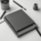 project prototype details with papers or journal on desk for web design black and white wi