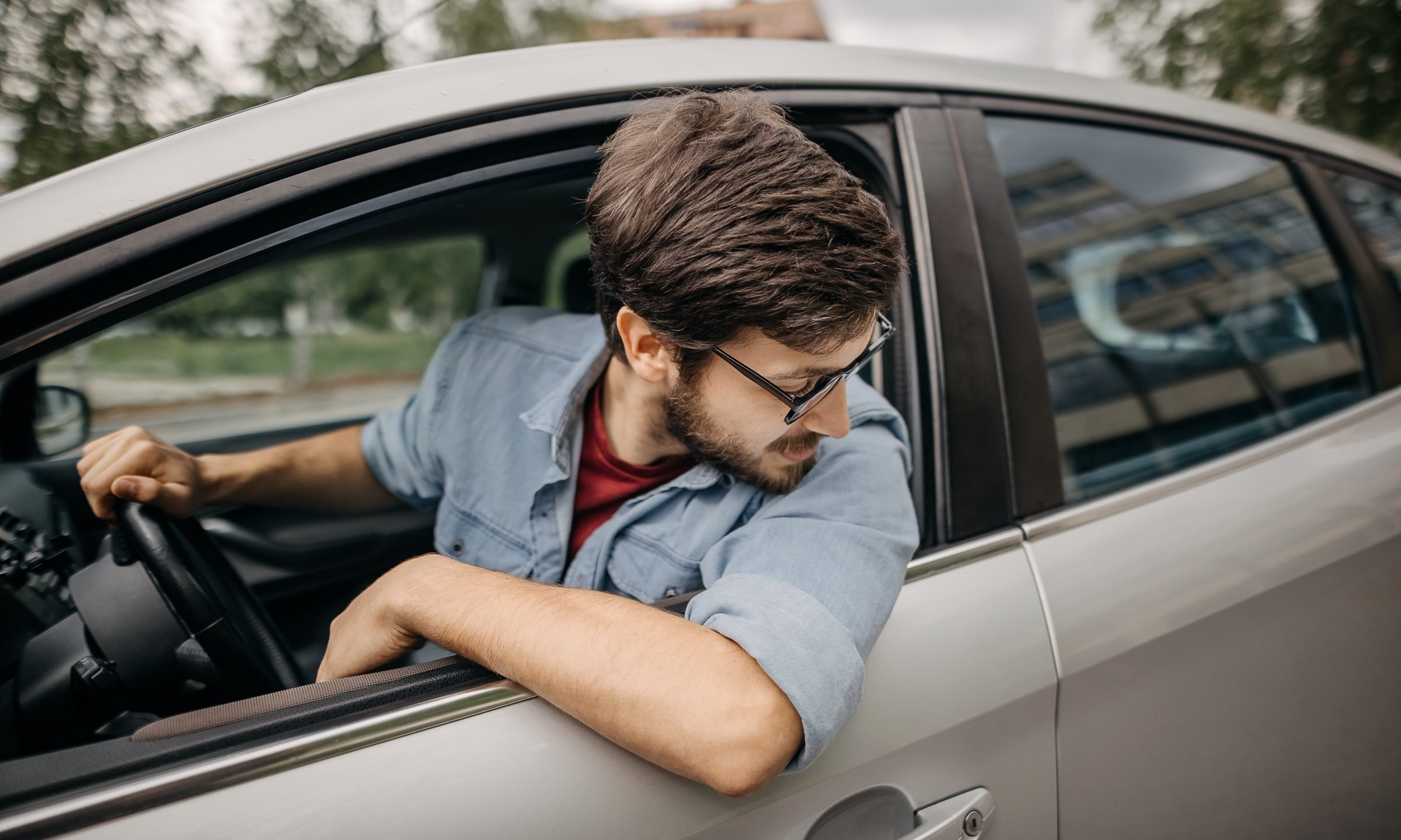 man reversing car