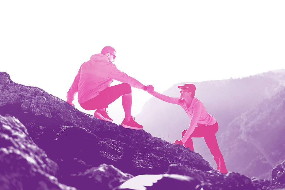 two-climbers-assist-each-other-while-scaling-rocky-mountain-sunrise-golden-light-highlight