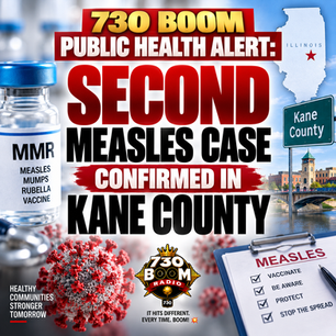 730 BOOM Radio public health alert graphic announcing a second confirmed measles case in Kane County, Illinois. The image features an MMR vaccine vial, measles virus imagery, an Illinois map and Kane County sign. The official 730 BOOM Radio logo is centered at the bottom.