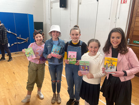 World book day , creative costumes + Senior classes doing paired reading with our Junior infants