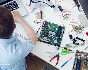 Electrical engineer working on circuit board