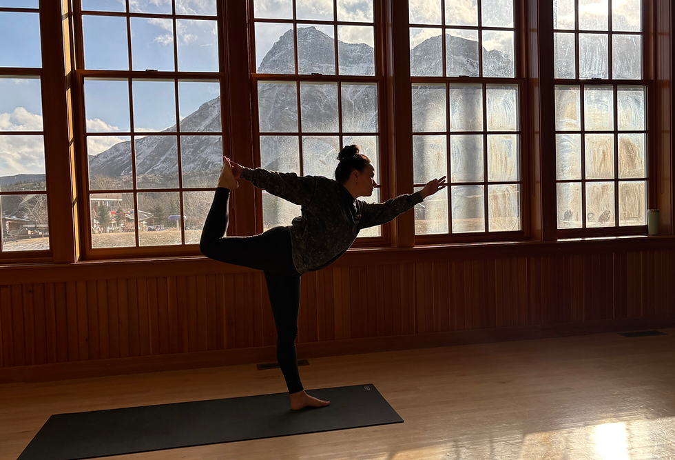 Woman in dancer yoga pose, Partners of First Thunder Wellness.