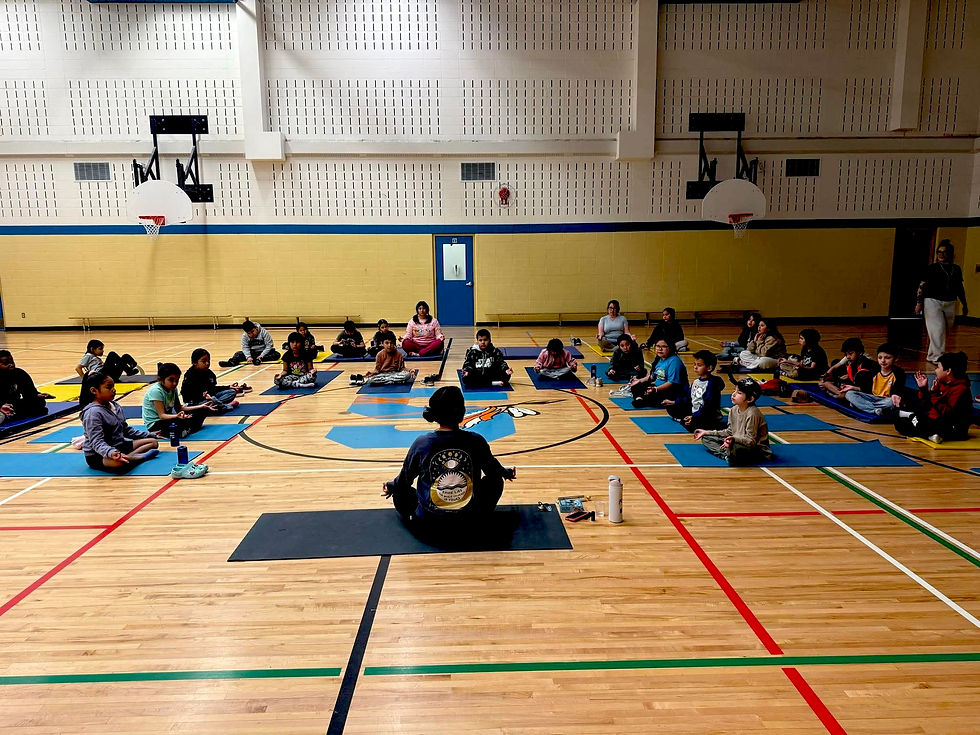 Children practicing yoga with Partners of First Thunder Wellness.
