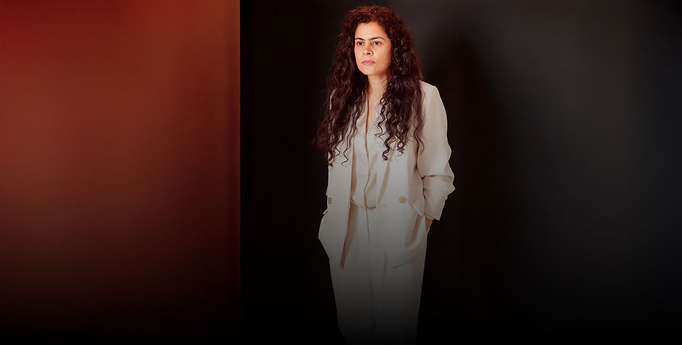 Fine art portrait of a female leader in a tailored cream suit for the Journeys of Women project, capturing the authentic woman behind the executive role to humanize corporate leadership.
