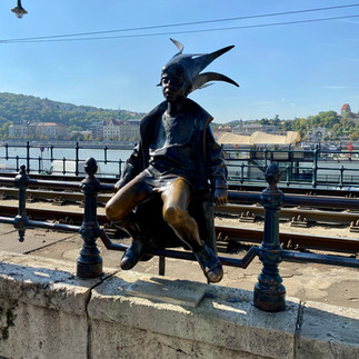 statue of a little girl near the Danube river in Budapest
