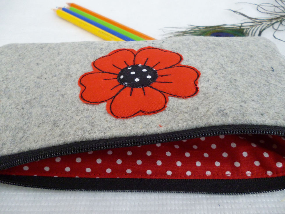 Thumbnail: Inside of grey fabric poppy makeup pouch with red polka dot lining