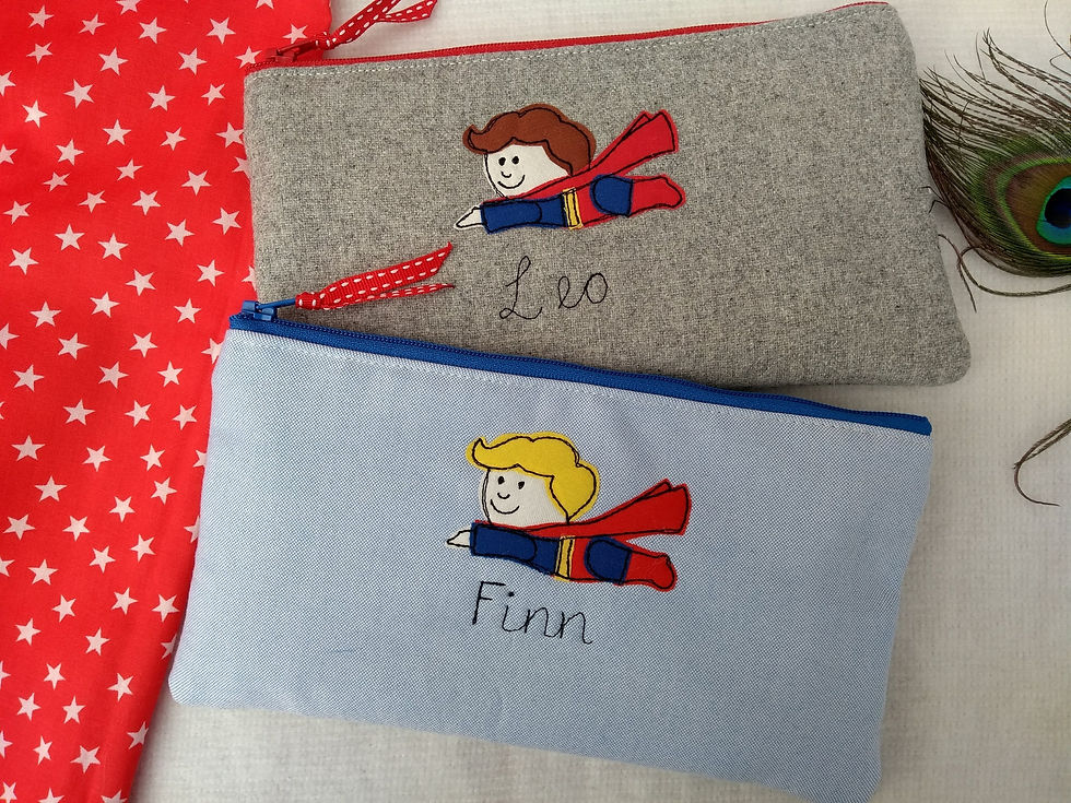 Superhero personalised pencil case with choice of colour. Star cotton lining. Fastened with zip and ribbon pull. Ideal boy
