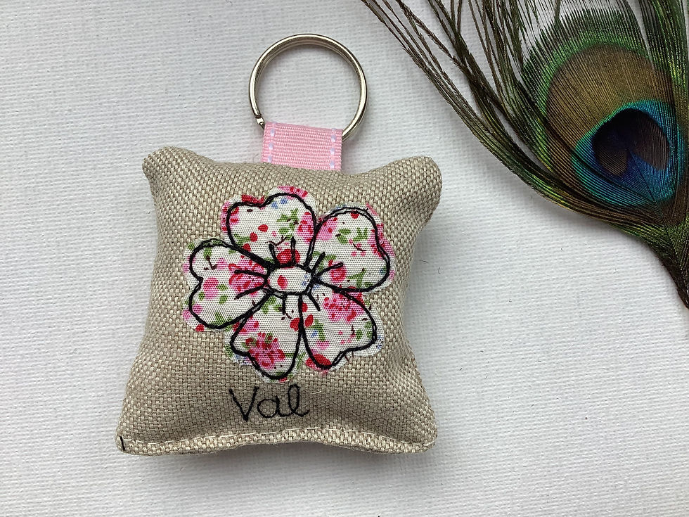 Thumbnail: Appliquéd flower motif on linen. Fabric keyring with optional lavender scent.  ribbon and split ring fastener