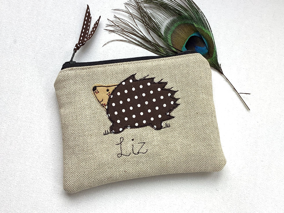 Hedgehog motif applique on linen coin purse or wallet.  Chocolate dot lining and fastened with zip and ribbon pull