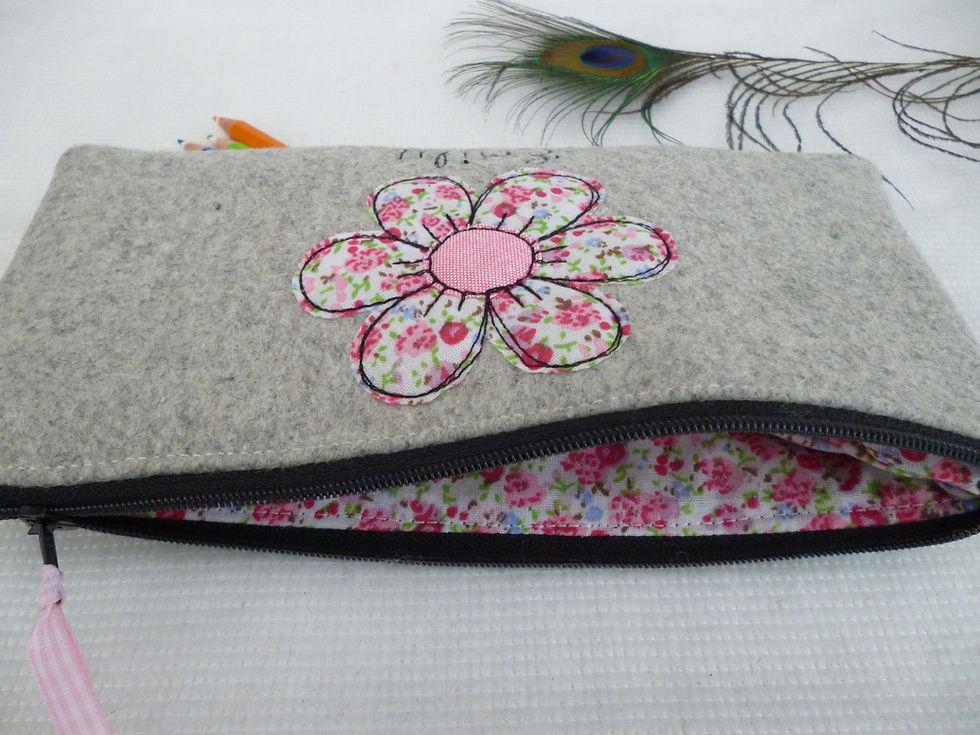 Thumbnail: Inside of grey fabric pencil case with pink floral fabric