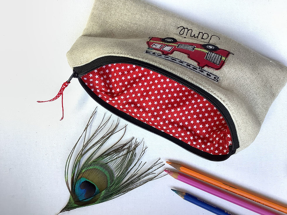 Thumbnail: Personalised fire engine pencil case on blue, grey or oatmeal.  red dotty lining and fastened with zip and ribbon pull