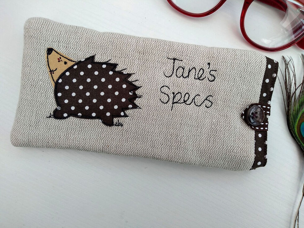Hedgehog motif applique on linen glasses spectacles sunglasses case. Chocolate dot lining and fastened with ribbon button