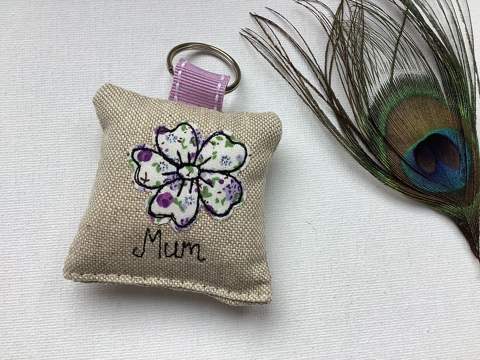 Thumbnail: Appliquéd flower motif on linen. Fabric keyring with optional lavender scent.  ribbon and split ring fastener