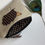 Thumbnail: Hedgehog motif applique on linen coin purse or wallet.  Chocolate dot lining and fastened with zip and ribbon pull