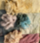 Pieces of raw fleece and cotton fabric dyed with natural plant dyes