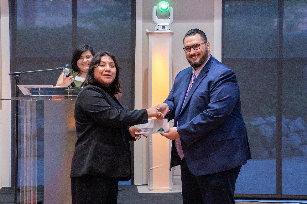Fellow receiving scholarship check