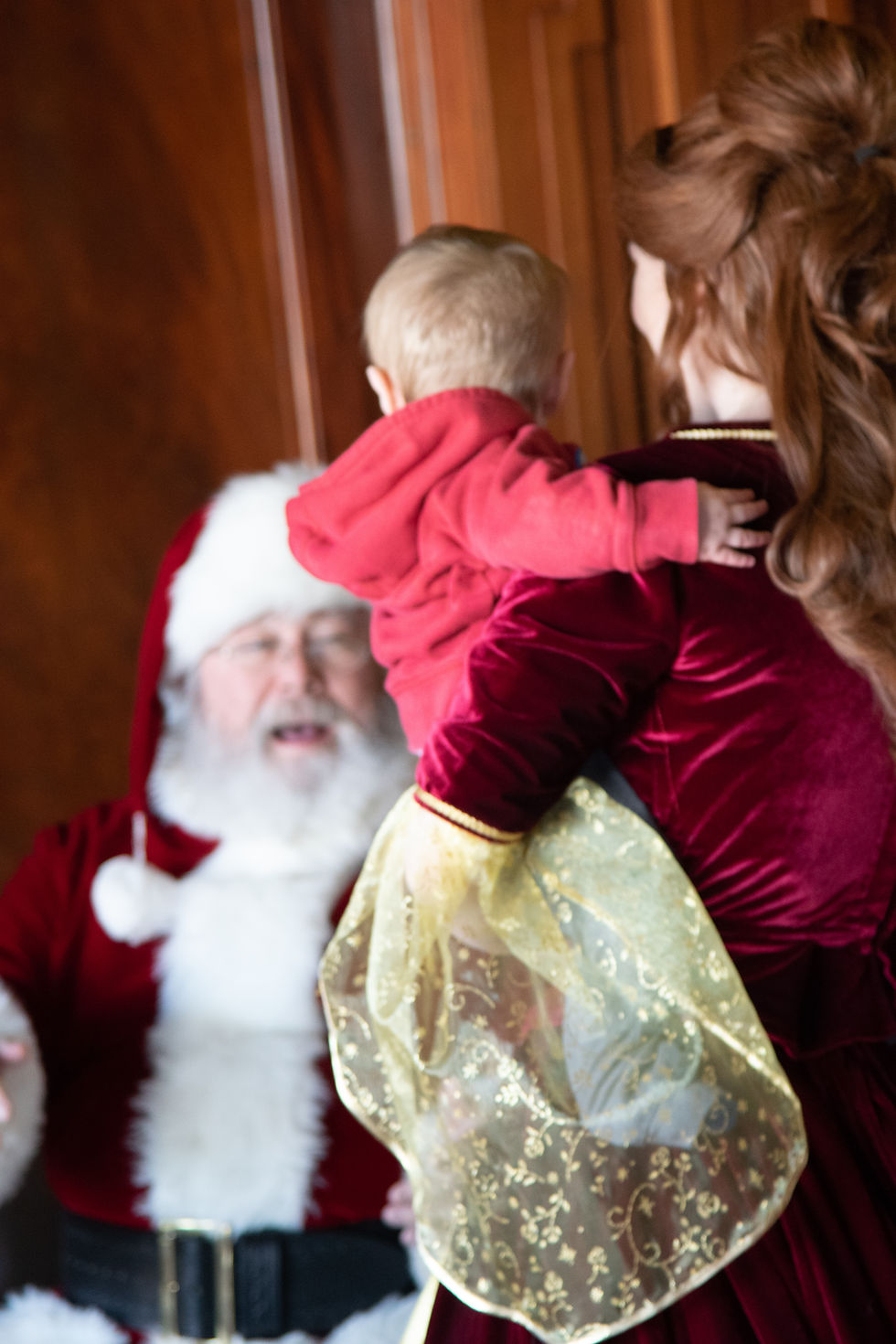 Princess Beauty & Santa bringing Christmas cheer to the library.