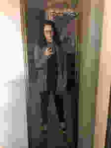 Black shirt, black jeans, black Vans, grey cardigan