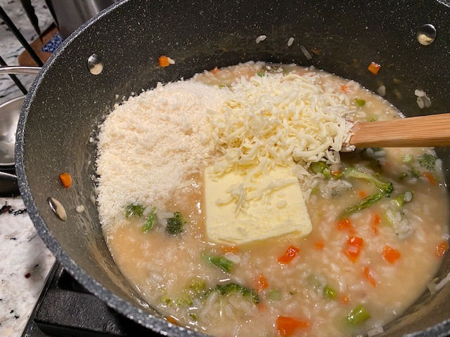 Stir in butter and cheeses