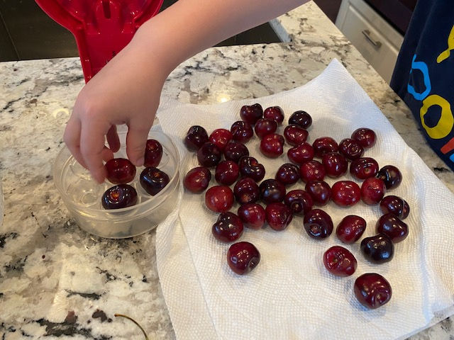 Clean cherries to pit