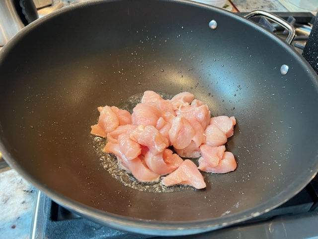 Brown chicken in hot oil
