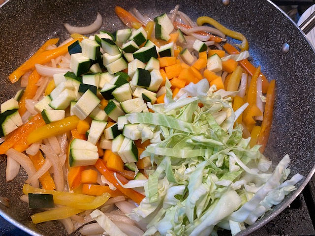 Add veggies to sautéed veggie 