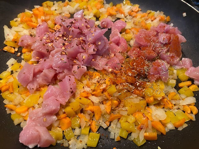 Adding turkey and spices