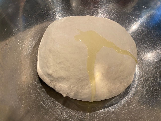 Pour little oil on dough