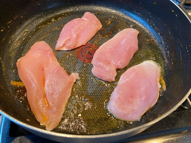 Fry seasoned chicken