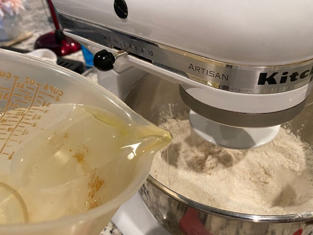 Pour warm water and oil in