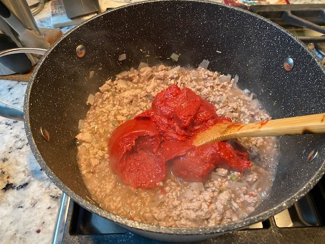 Stir in tomato paste 