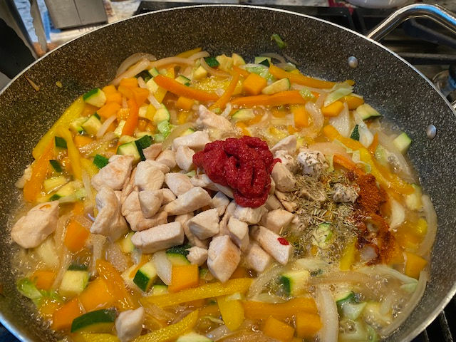 Add paste and spices
